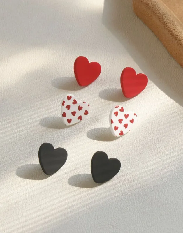 Ladies earrings worldwide appeal-Charming Heart Trio Set: Red, White, and Black Stud Earrings